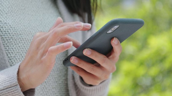 A person holding a cell phone